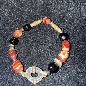 Elegant Beaded Bracelet with Gold and Black Accents